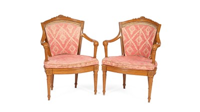 Lot 381 - A pair of French painted and carved open armchairs