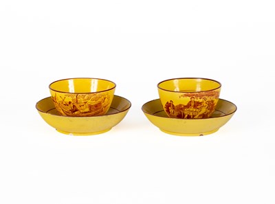 Lot 811 - A pair of yellow ground tea bowls and saucers