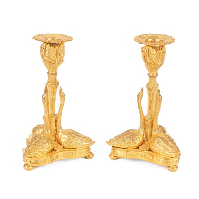 Lot 904 - A pair of French gilt-metal candlesticks