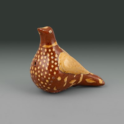 Lot 635 - A slipware bird whistle