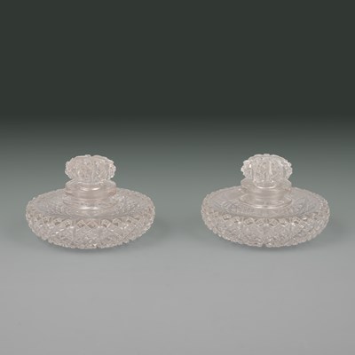 Lot 654 - A pair of late Regency or William IV cut glass scent bottles or perfume bottles and stoppers
