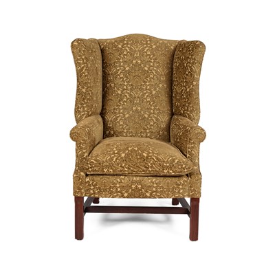 Lot 518 - A George III style wing back armchair