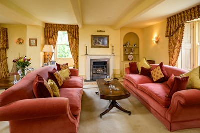 Lot 533 - A pair of three-seater sofas