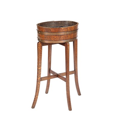Lot 552 - A coopered oak plant stand