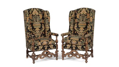 Lot 563 - A pair of William & Mary style upholstered wing back armchairs