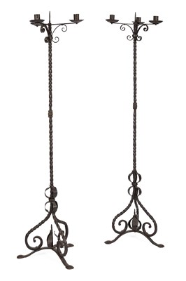 Lot 569 - A pair of wrought iron tripod candlestands