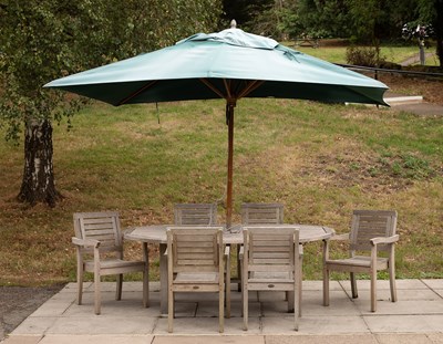 Lot 500 - A teak garden table and six chairs