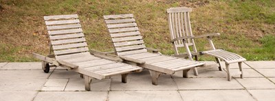 Lot 505 - Two teak garden loungers