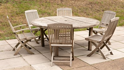 Lot 506 - A circular garden dining table