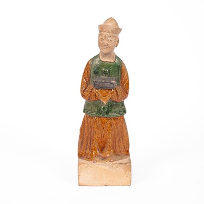 Lot 182 - A Chinese pottery Sancai glazed attendant
