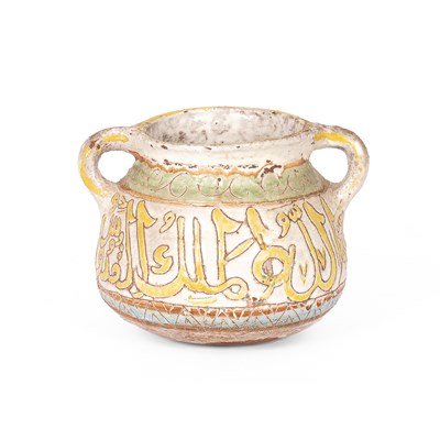 Lot 143 - An Islamic two-handled pottery vase